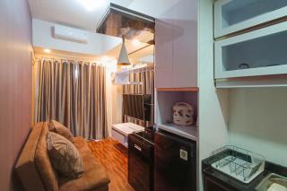 Simply 1BR at 31st Floor Vida View Makassar Apartment By Travelio - Pampang - 1