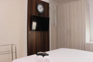 Cozy Stay and Tranquil Studio Patraland Urbano Apartment By Travelio - Bekasi - 1