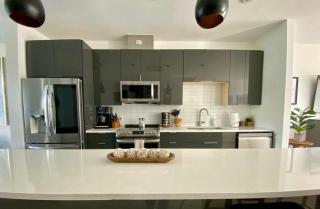 Upscale 2BR Condo w Patio City Views Walk to DT - 8