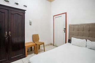 SPOT ON 93464 Penginapan Tulimario Syariah - Jambi - 0