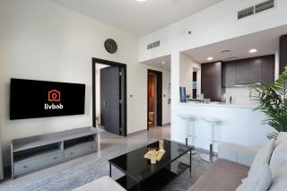Livbnb Suites - Bright 1 BR Suite in Merano Tower - Dubai - 0