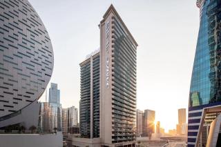 Livbnb Suites - Bright 1 BR Suite in Merano Tower - Dubai - 2