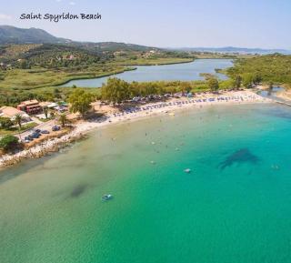 Kalimera Summer Apartment on the North Coast of Corfu, featuring a large, sunny flower-filled terrace with mountain views - 1