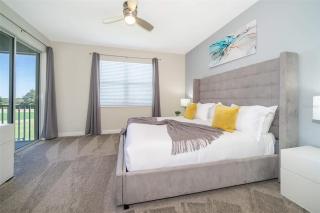 Wonderful Disney-Themed Home in ChampionsGate Resort 15 min from Disney World with 7 pools, Club houses, Water Park, Gym, Arcades, Lazy River, Golf, and More! - 7