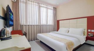 Kunming Tong Yi Business Hotel - Kunming - 1