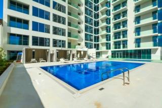 Pool and Community View Studio,Just Steps Away from the Mall, Concept 7 Residences, Jumeirah Village Circle by Deluxe Holiday Homes - 2