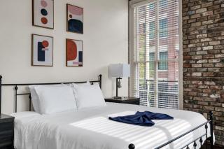 Modern 1BR condo w exposed brick & king bed - 1