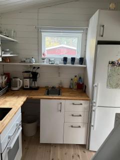A simple stuga on a lake incinerating toilet in a separate building next to the cabin Water for drinking and washing hands dishes comes from two containers that attach to a faucet through a simple electric pump OBS no shower on site - Grythyttan - 6