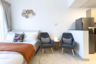 Serene studio apartment with Burj Khalifa view in Jumairah Village Circle JVC - 9