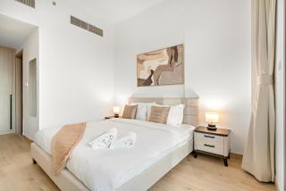 Bright 2BR Retreat Balcony & Pool Near Jumeirah Village Circle - 1