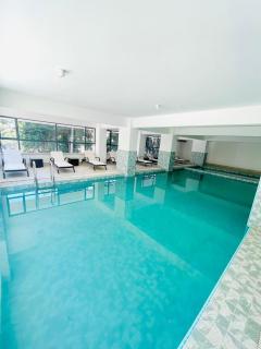 celestial modernly furnished four bedroom apartment which features amazing city views, swimming pool ,ample private parking space and rooftop chill spot - Nairobi - 7