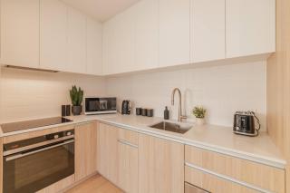 Central 1BR Apartment with Kitchen & Patio - 1