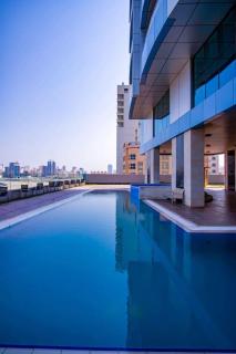 Blue Seaview 75 inch Smart TV 1Br - Manama - 2