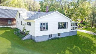 Embrace Nature in this Breathtaking Cottage in Portage Lake, Maine - - 0