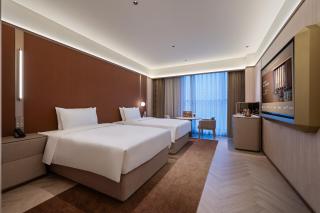 Orange Crystal Qingdao Liaoyang West Road Guoxin Sports Center Hotel - Qingdao - 1