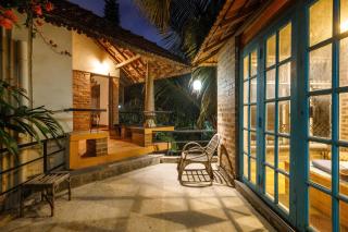 Kerala Style Villa by JadeCapsAC4BHKFishpond - 2