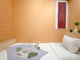 Relaxing 2BR with Pool View Mutiara Bekasi Apartment By Travelio - Bekasi - 1