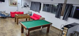 Belíssima Casa a Beira Mar com Piscina Aquecida Cobrado a Parte, 5 Quartos com Ar Condicionado, Amplo Salão de Jogos com Mesas de Bilhar e Pebolim, Amplo Espaço Externo com Churrasqueira em Deck Gourmet Coberto frente a Piscina,Tudo isso á Beira Mar - 1
