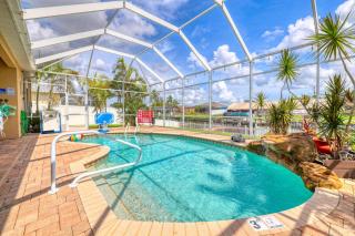 2790 Sq Ft, Open Concept, One Story Gulf Access Home with Private Dock and 20,000 lb Boat Lift, Fenced Yard, Heated Pool with Waterfall, Bikes, Fishing and Beach Gear, Family Ready and Dog Friendly! - 8