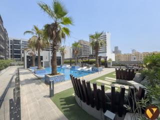 Vogue One Bedroom Apartment at Chaimaa Avenue JVC with Balcony, Pool and Gym Access, Near Park and Circle Mall - 0