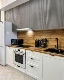 Stylish Studio Apartment with a Separate Bedroom - 1