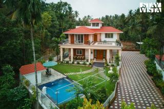 StayVista at 27 Flora with Lawn, Pool, WiFi - Nagaon - 9