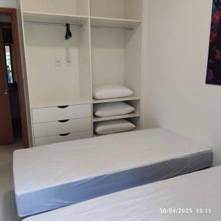 Apartamento novo a 350 m da praia das Toninhas em Ubatuba - 2 dormitórios sendo 1 suite, piscina, varanda gourmet com churrasqueira, ar condicionado, cozinha completa, garagem privativa - 3