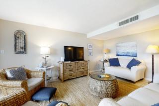 Renovated condo with balcony, lush views, outdoor pool - 5