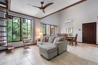 Modern Island-Themed Condo with Floor-to-Ceiling Windows & Garden and Pool Views Within Walking Distance of the Beach - 9