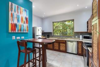 Modern Island-Themed Condo with Floor-to-Ceiling Windows & Garden and Pool Views Within Walking Distance of the Beach - 4