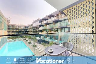 Vacationer Holiday Homes I Stylish 2 Bed l Balcony with Pool Views l JVC - 0