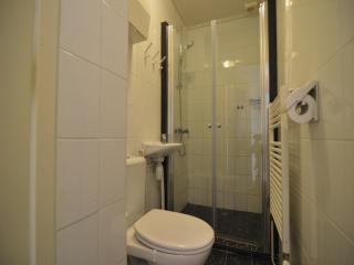 A detached bungalow with outdoor fireplace, covered terrace and pond in a forest plot - 1