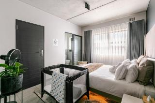 Cityescapes 2F in Waterfall Midrand - Beautiful self catering 2 bedroom unit next to Kyalami Racetrack with free WiFi swimming pool gym and restaurant - Perfect for a small family - 0