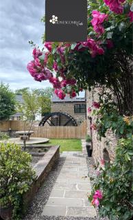 FLOUR MILL HOUSE at PITKERRO MILL, 4 double bedrooms, TVs, 3 en-suite, separate shower, wc, fully equipped kitchen, games room, large family lounge, private parking, WiFi, private garden and courtyard, long stay rates available through Honeycomb Hosts - 0