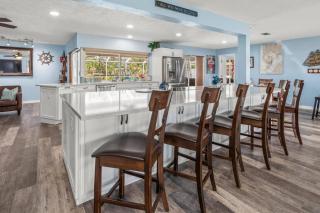 Pirates Den a 4BR Pet-Friendly Waterfront Oasis with Pool, Dock, Personal Water Boats, Fire Pit, Game Room and Bar - 2