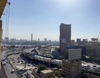 Cozy bedroom overlooking downtown & the Nile - 7