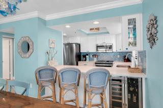 Updated direct oceanfront corner with a wrap-around balcony, heated pool and beach access - 6