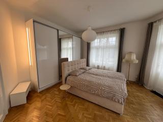 A stylish and comfortable 2 bedroom apartment with thoughtful design, private balcony, and a relaxing bathtub, making it perfect for well being and cozy city living - 9