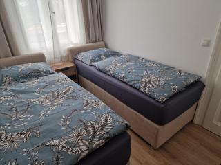 A stylish and comfortable 2 bedroom apartment with thoughtful design, private balcony, and a relaxing bathtub, making it perfect for well being and cozy city living - 1