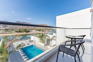 Modern 3BR with Mountain Views and Private Pool in Al Dana Island, Fujairah by Deluxe Holiday Homes - 0