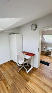 Charming Attic Retreat with Sloped Roof - 1