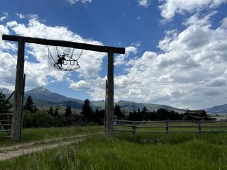 Scenic Mountain Cabin with Creekside Deck & Outdoor Fireplace near North Meadow Creek, Montana - 1