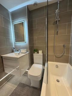 Spotless Two-Bedroom Home with Garden and Parking - 1