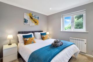Spotless Two-Bedroom Home with Garden and Parking - 0