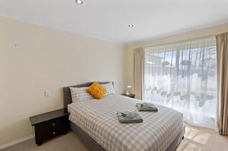 Comfortable 4-Bedroom Home with Backyard Escape - 0