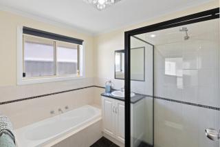 Comfortable 4-Bedroom Home with Backyard Escape - 3