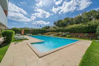 Sunlit Poolside Retreat w/ Balcony by HostWise - 0