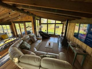 5 Star Country Retreat, huge Log Cabin over small river, with private hot tub & log burner, WiFi, 65 inch smart TV relax read at Weston Newark, Nottinghamshire - 0