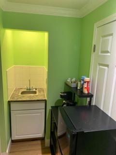 Private suite with small kitchen private bathroom entrance porch and driveway - 4