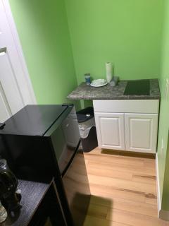 Private suite with small kitchen private bathroom entrance porch and driveway - 5